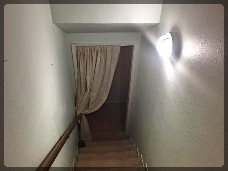 Stairs going to the negative bedroom